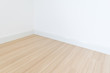 © catshila - White wall with a hardwood wooden floor