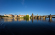 © René Pi - Charles Bridge Across River Vltava In Prague At Sunset