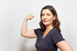self-confident woman flexing biceps muscles
