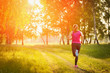 © PAstudio - Young fitness woman running on the park.