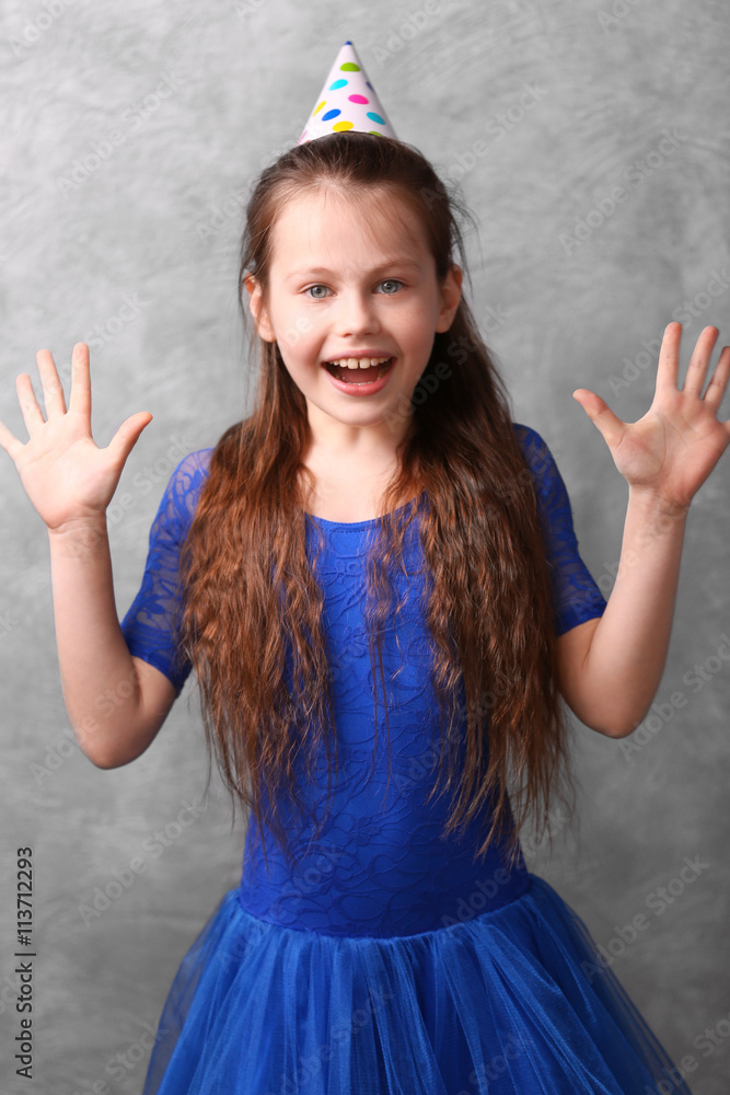 Cute girl on grey background