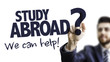 © gustavofrazao - Business Man Pointing the Text: Study Abroad? We Can Help!