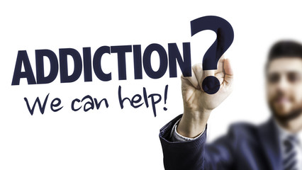 business man pointing the text: addiction? we can help!