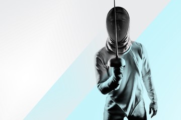 Wall Mural - Man wearing fencing suit practicing with sword