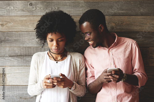 African Couple Using Gadgets Pretty Girl With Afro Hairstyle In