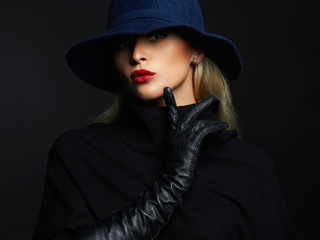 Wall Mural - Beautiful woman in hat and leather gloves. Retro fashion girl with red lips