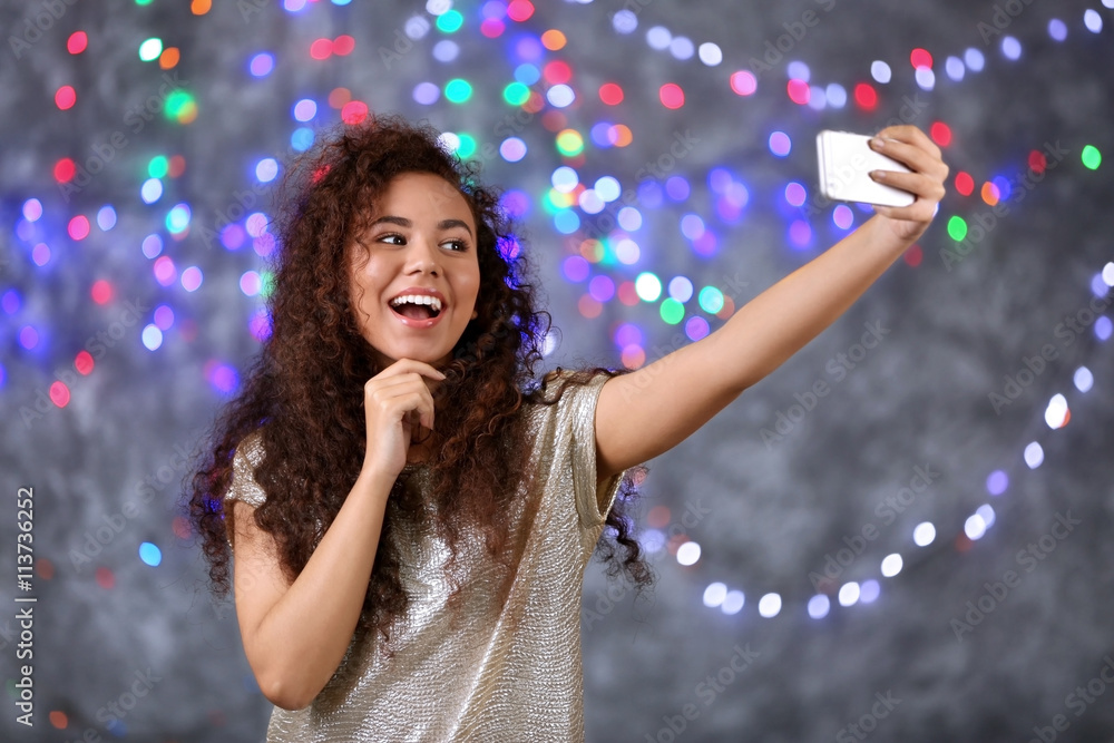 Young attractive woman taking selfie