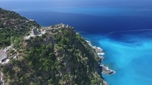 Aerial: Flight Over Ancient Village Of Nonza, Black Beach And Spectacular Cliffs, Typical Landscape On Corsica Island, France, Europe 