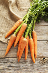 Canvas Print - Fresh and sweet carrot on a grey wooden table