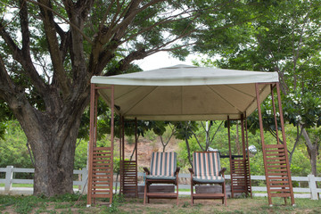 relax two chairs in party tent for picnic in garden