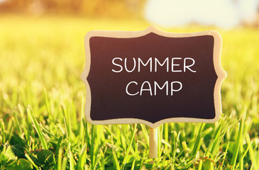 Wall Mural - Wooden chalkboard sign with quote: SUMMER CAMP