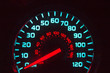 Speedometer at night, blue and red