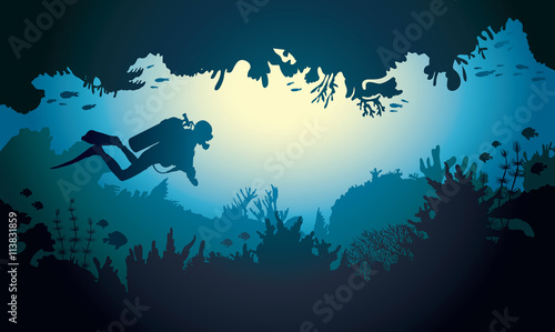 Cuadros en Lienzo Silhouette of underwater cave with diver and coral reef.