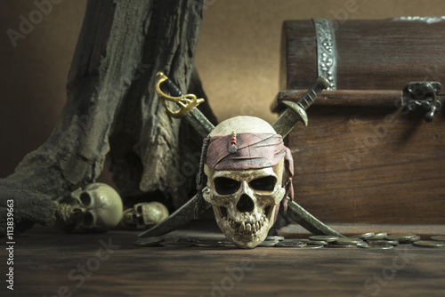 pirate skull with two swords and coffer