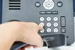 Dial the number pad of IP phone with human left hand