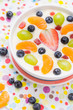 © Yotka - Delicious milky vanilla pudding colorful fruit
