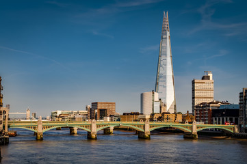 Wall Mural - London’s south bank seen from the Millennium Bridge with London Bridge, Tower Bridge and river Thames at golden hour