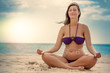© detailblick-foto - Schwangere Frau am Strand macht Yoga