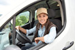 © goodluz - Delivery woman driving van