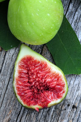 Wall Mural - Healthy organic green figs in bowl on rustic wooden table