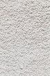 White roughcast lime mortar plaster wall background texture on an old building made from sand and lime in the original tradition