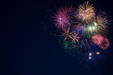 Fototapeta Na sufit - Beautiful celebration sparkling fireworks over starry sky, copy