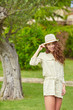 © ZoomTeam - Smiling summer woman with hat  in italian garden