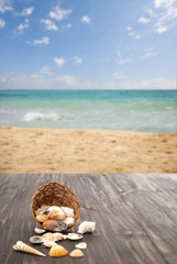 Wall Mural - Summer, beach, holidays, basket of seashells on wood table