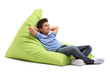 © Ljupco Smokovski - Relaxed boy laying on a beanbag