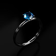 Blue diamond ring on dark background , 3d rendering
