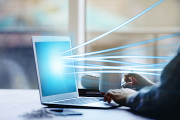 Modern laptop streaming data. New technology concept