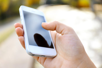 Sticker - Woman holding smartphone outside