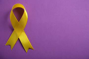 Wall Mural - Yellow ribbon on purple background