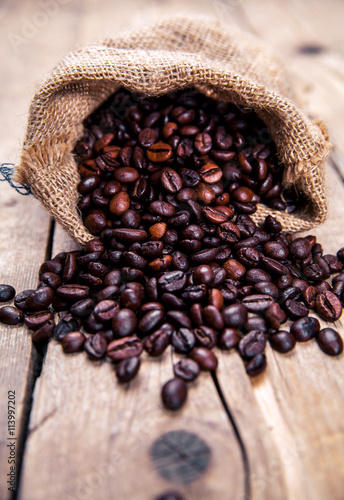 Fotografie, Obraz Coffee beans on the wooden background. Hot drinks.