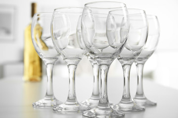 Canvas Print - Wineglasses on blurred interior background