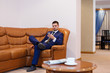 © ellesse05 - Young businessman drinking coffee and talking on the phone