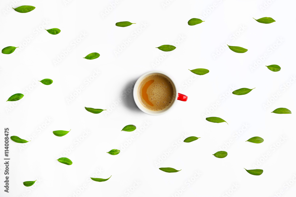 Cup of tasty coffee with leaves on white background