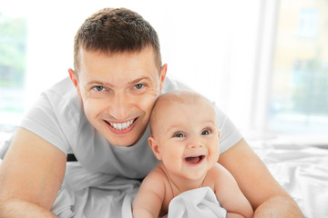 Wall Mural - Portrait of happy father and cute baby