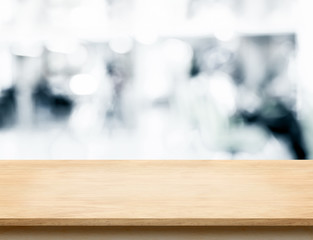 Empty wood table top with abstract blur background with bokeh li