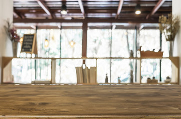 Wall Mural - Selected focus empty brown wooden table and Coffee shop blur bac