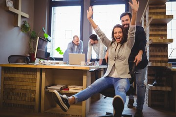 Happy coworkers enjoying in creative office