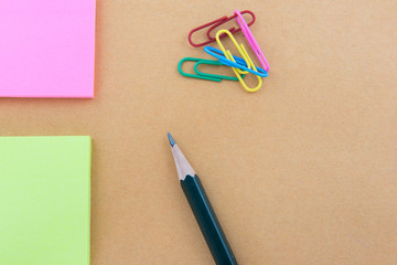 Color  Paper notes with sticky note on brown Background