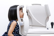 Leinwandbild Motiv Asian Little Chinese Girl Doing Eyes Examination Through Auto re