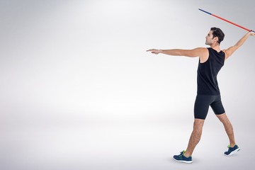 Canvas Print - Composite image of male athlete preparing to throw javelin