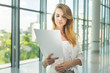 © snedorez - Businesswoman hold some documents
