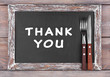 Blackboard menu with text Thank You on rustic wooden planks background