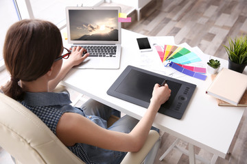 Poster - Woman using graphic tablet at office