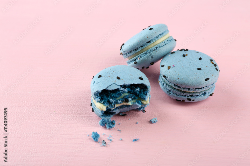 Tasty macaroons on pink background