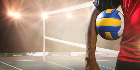 Canvas Print - Composite image of mid-section of sportsman holding a volleyball