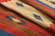 Close up of a hand woven striped patterned indian kilim carpet